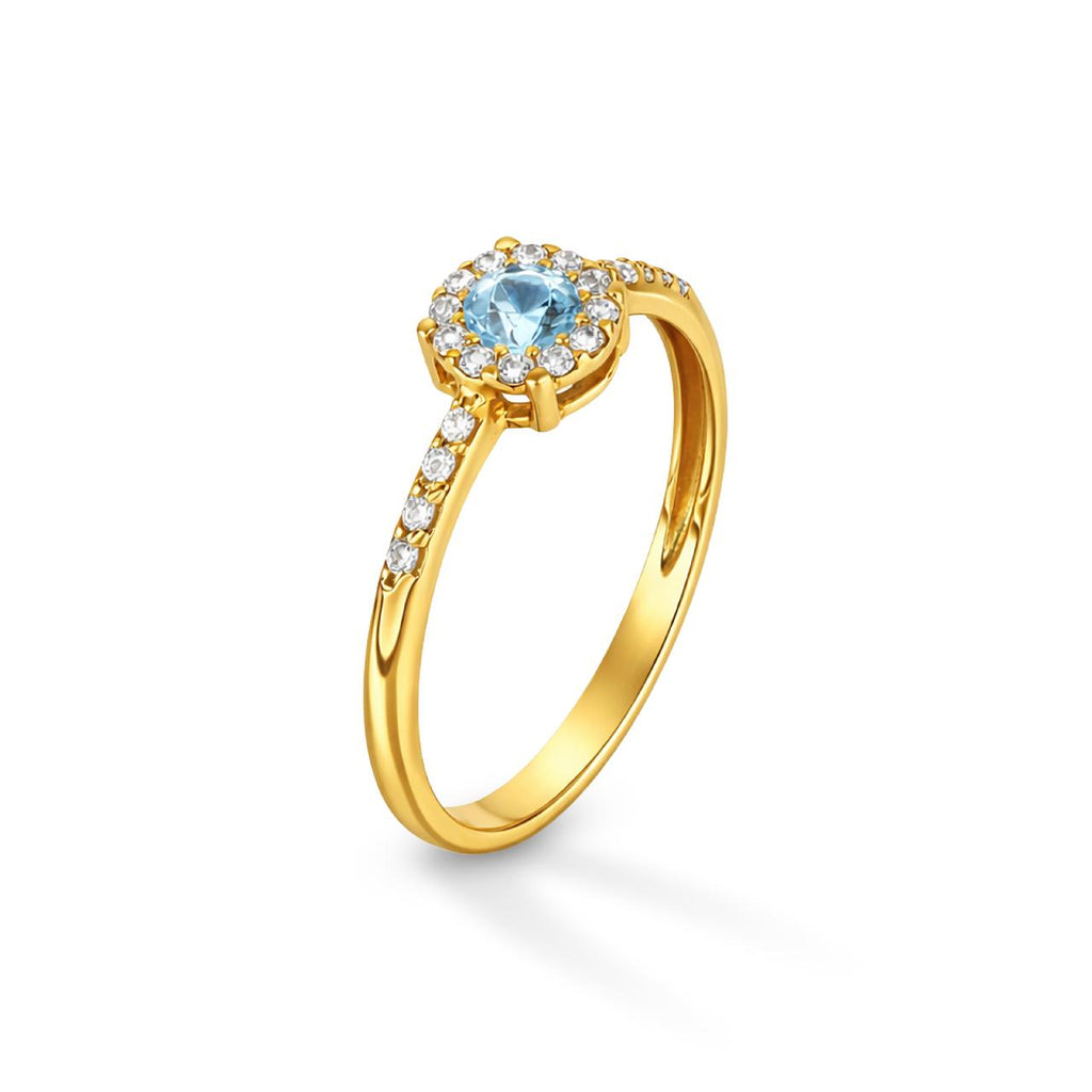 Anello Magic con zircone acquamarina centrale e contorno di micro-zirconi bianchi