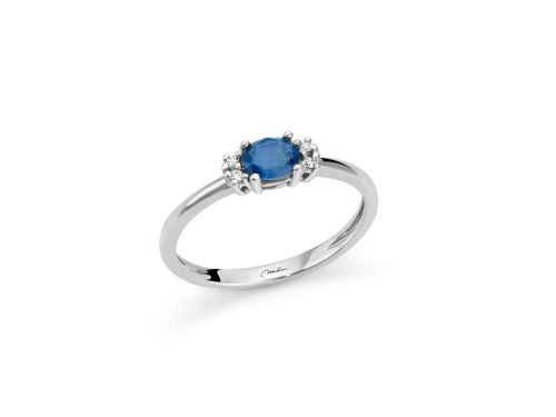 Anello con zaffiro blu ovale e diamanti in oro bianco 375
