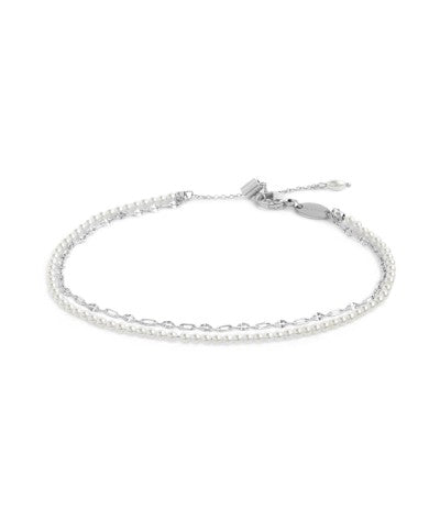 Cavigliera doppia catena con perle bianche e lip-cable